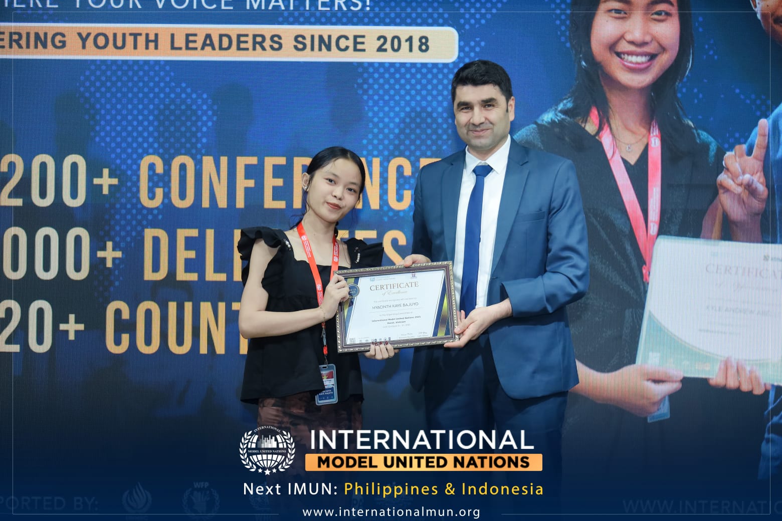 Hyacinth Kaye Bajuyo receiving certificate at International MUN Vietnam 2025